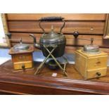 Two German wood coffee grinders with crank handles and small drawers; and a copper tea kettle with