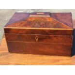 A large nineteenth century mahogany tea caddy with rectangular tablet to top on sarcophagus shaped