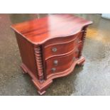A dwarf serpentine mahogany chest, the three drawers mounted with ring handles flanked by