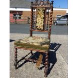 A Victorian rosewood chair with pierced scroll carved crest above a rectangular needlework panel