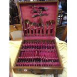 A cased canteen of Siamese brass cutlery, the hinged box with tray containing 79 pieces, mounted