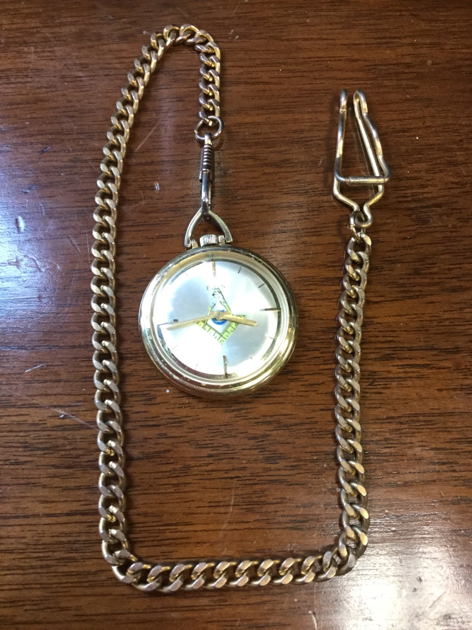 A 60s masonic pocket watch by Elgin, the dial with square & compass crossed decoration mounted on