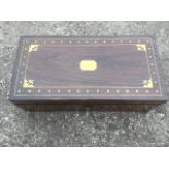 A regency rosewood writing box with brass inlay and military handles, having fitted interior with