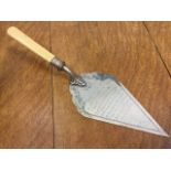 A 1927 silver plated topping-out trowel with ivory handle used by the Bishop of London for the