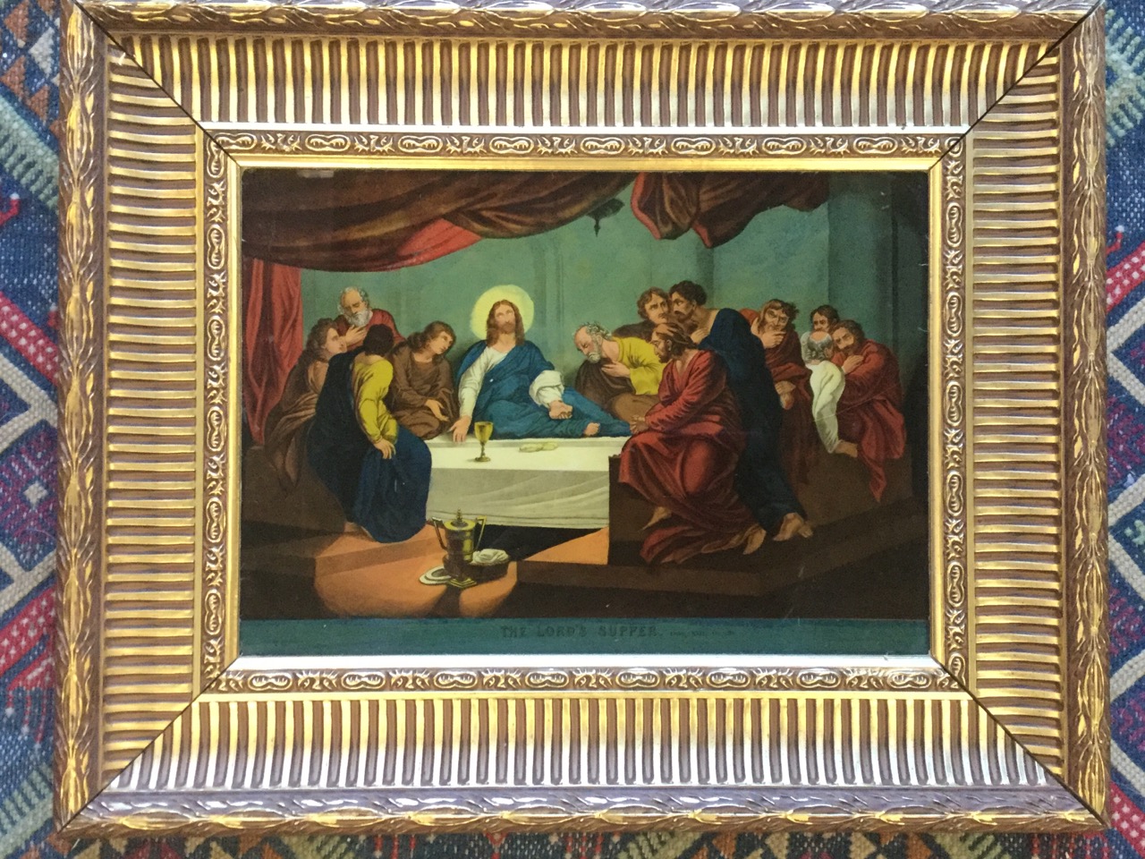 A Victorian coloured print of The Last Supper after James Bateman, handcoloured under glass, in