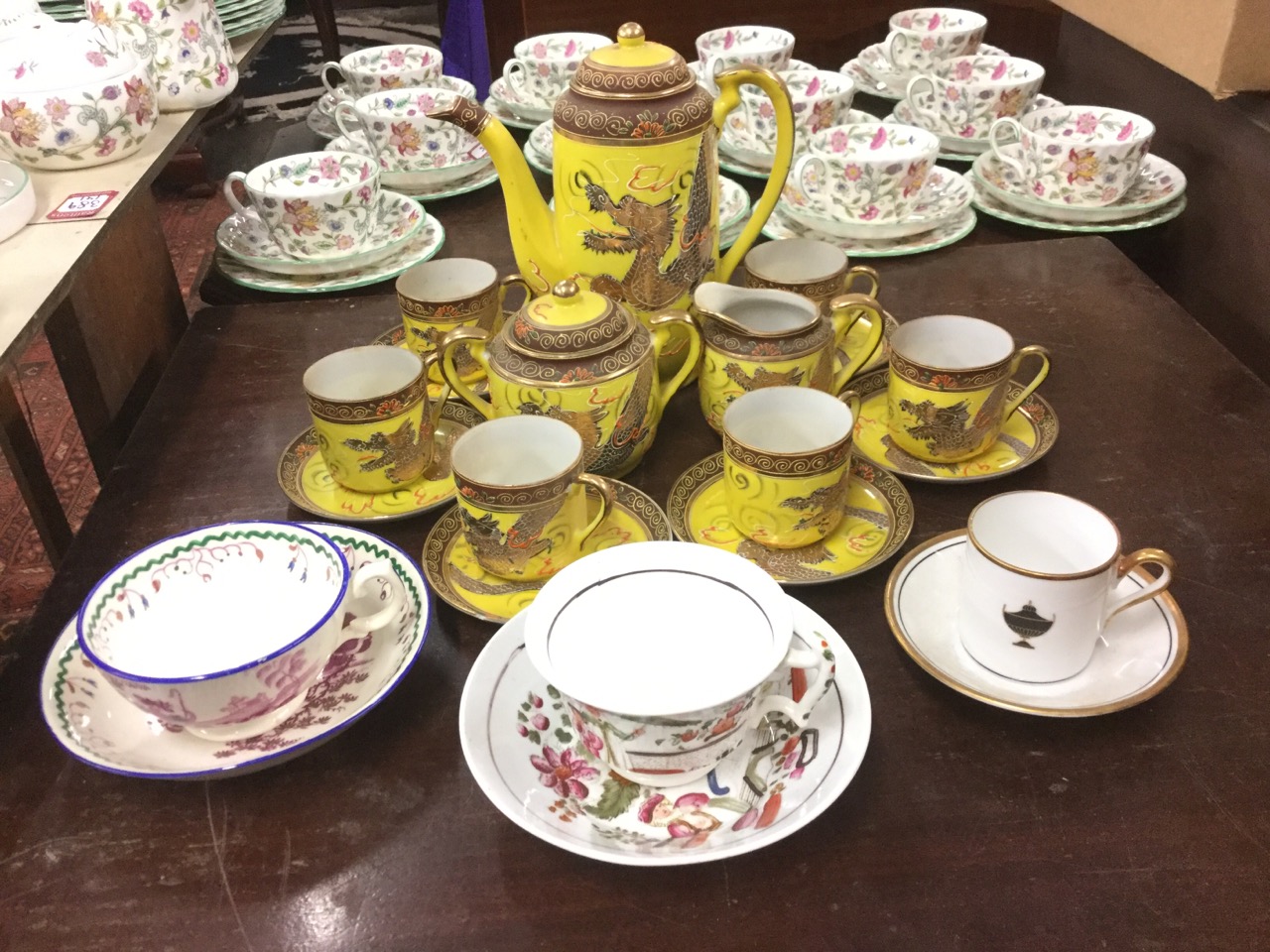 A Japanese six-piece enamelled coffee set with gilt dragons on yellow ground; and three nineteenth