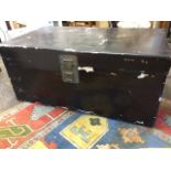 A large lacquered trunk, the box with brass hasp lock. (45in x 26in x 20in)