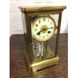 A Victorian Japy Freres & Cie brass four-glass mantle clock, the architectural style case with