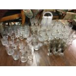 A quantity of drinking glasses - sets, tumblers, wine, smoked glass, liqueur, beer tankards,