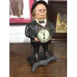 A cast iron automaton clock after a patent dated 1857 by Bradley & Hubbard, modelled as a portly