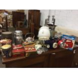 Miscellaneous items including two cast iron kitchen mincers, old tins of buttons, torches, a deco