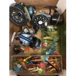 A collection of fishing tackle including fly and spinning reels, Devon minnows, spinners, tobys,