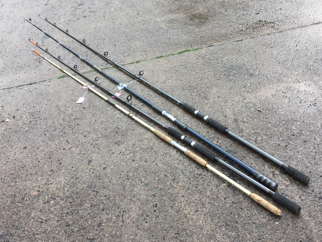 Three long beachcasting rods; and a fibreglass sea fishing rod. (4)