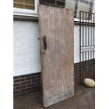 An old tongue & grooved batten pine door with strap hinges, suffolk latch and rimlock with key. (