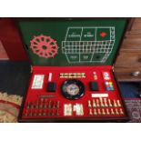 A games coffee table, the rectangular hinged tray top revealing a fitted interior with games boards,