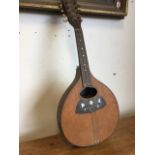 A Victorian mandolin by Jul Heinr Zimmerman of Leipzig, the instrument with chequered inlaid