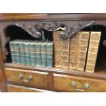 A set of eight leather bound Walter Scott volumes with marbled boards, published in 1862 by Adam &