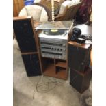 A Binatone hi-fi stack with glazed door having turntable, receiver, amplifier, twin cassette,