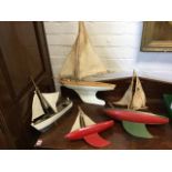 Three toy pond yachts by Staryacht of Birkenhead, all with deep keels and original sails; and a