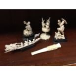 Five pieces of carved Edwardian ivory - a cheroot holder with dragon carved collar, a bearded figure