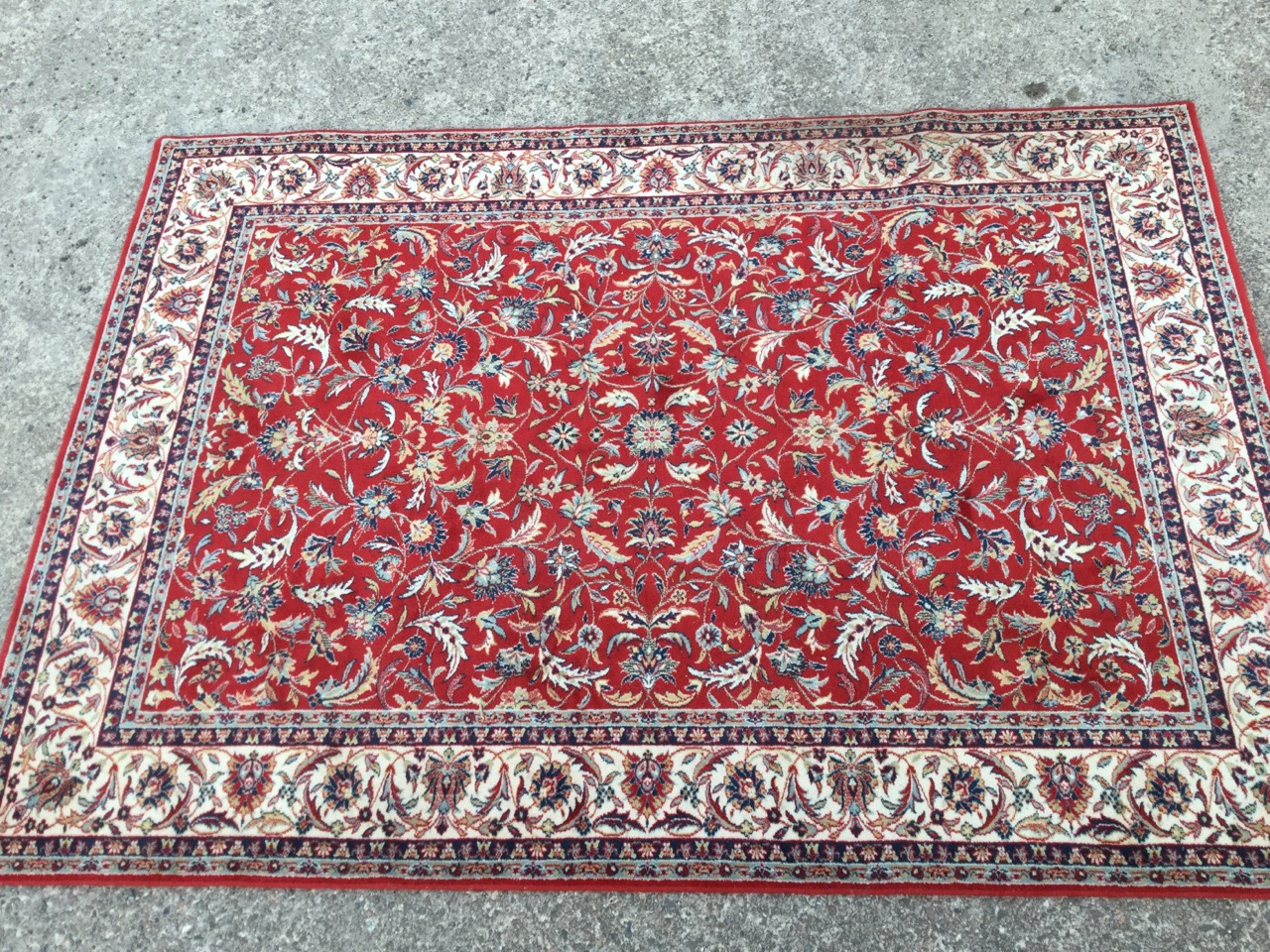 A Galileo oriental style wool rug, the red field woven with interlaced foliage within an ivory - Image 2 of 3