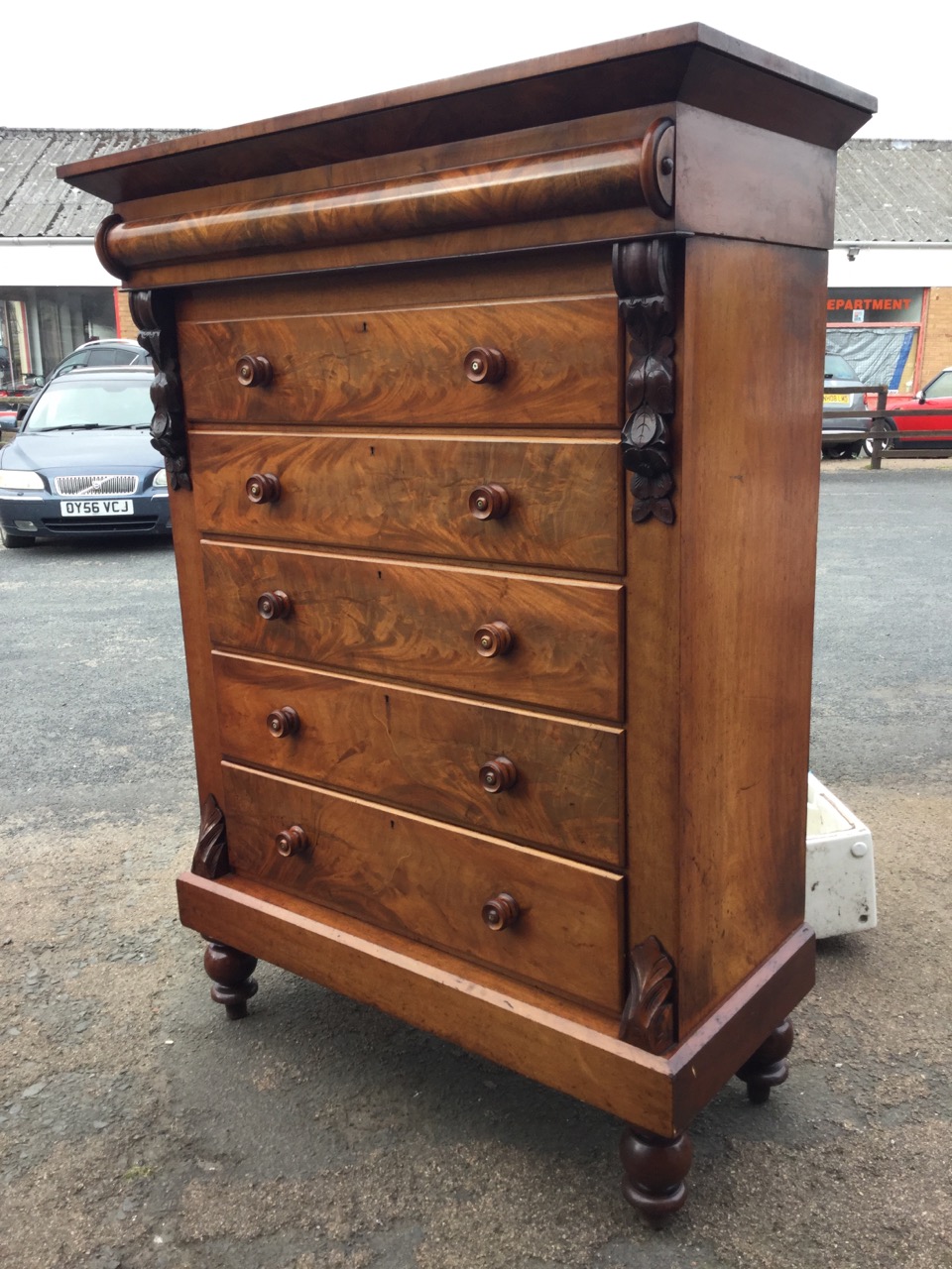 A large Victorian Scotch chest, the angled cornice with top hatch above a split column frieze, the