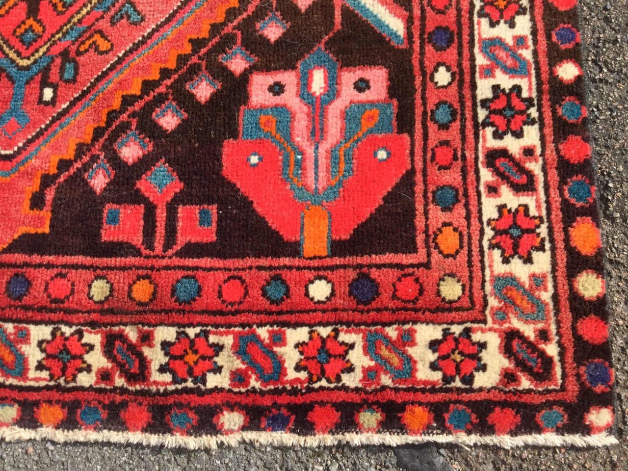 A oriental style wool rug woven with the serrated medallions in brown field with stylised flowers, - Image 3 of 3