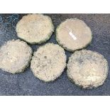 A set of five composition stone garden flagstones moulded as tree-trunk slabs. (15in) (5)