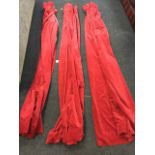 A set of three lined red velvet curtains. (82in) (3)