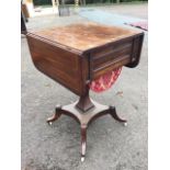 A George IV mahogany side table, the crossbanded top inlaid with boxwood stringing having two drop