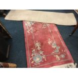 A Chinese thick pile rug woven with lanterns and foliage on pink ground - 49in x 29in; and a plain