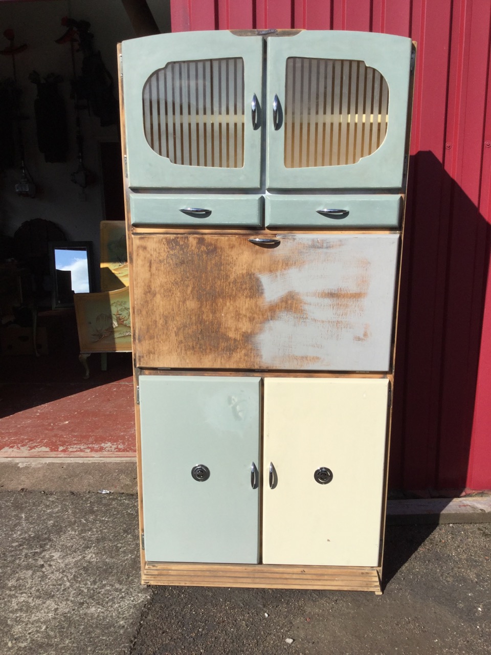 A part painted Shefco 60s kitchen cabinet, having striped acid etched glazed doors above two drawers