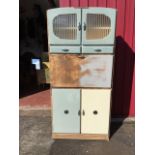 A part painted Shefco 60s kitchen cabinet, having striped acid etched glazed doors above two drawers