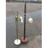 A tapering mahogany standard lamp with fluted column on circular saucer base with carved beading,