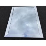 A large rectangular mirror, the plate with border of angled bevelled mirrors. (37.75in x 47.5in)