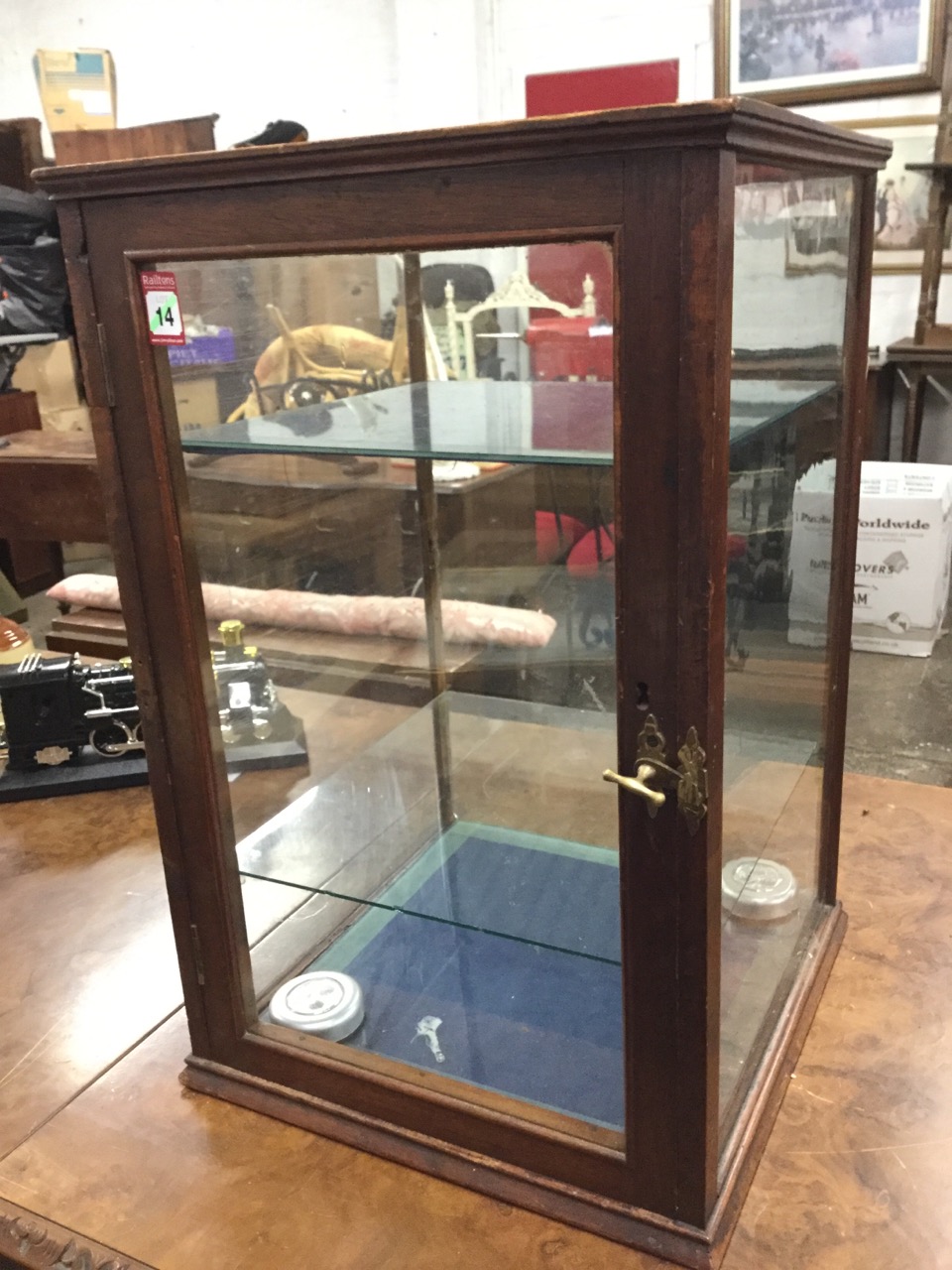 A square Edwardian mahogany counter-top glazed display cabinet, the front with rounded column