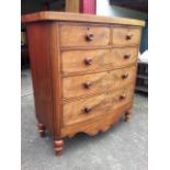 A Victorian bowfronted mahogany chest, with two short and three long graduated cockbeaded drawers