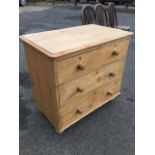 A Victorian pine chest of drawers, the rectangular rounded top above two short and two long