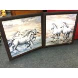 A pair of contemporary square prints of galloping horses in faux leather cushion moulded frames. (
