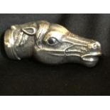 A sterling silver vesta modelled as a horse head with inlaid sapphire eyes, the sprung hinged collar