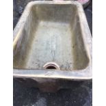 An Edwardian salt glazed stoneware trough by Brown & Son of Paisley, the basin with moulded flat rim