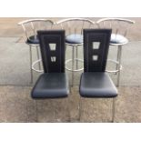 A set of three contemporary chrome swivelling kitchen stools with rounded backs and circular