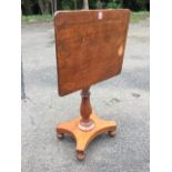 A nineteenth century mahogany snap-top occasional table, the rectangular top on an octagonal