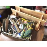 A box of miscellaneous tools, cables, materials, a pair of taps, a sharpening stone, a socket set,