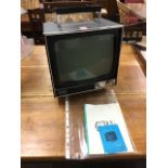A 70s Sony portable TV, the vintage telly with carrying handle and wire aerial, complete with