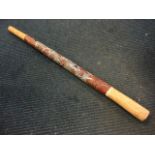 An Australian hardwood didgeridoo with naive stylised floral enamelled painted decoration. (52.