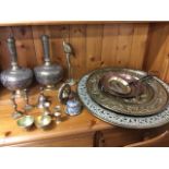 Miscellaneous brass & copper including circular embossed wallplaques, brass ornaments, bells, a pair