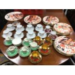 A Royal Crown Derby style twelve-piece dessert service decorated in the traditional brick red,