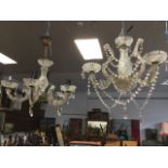 A glass chandelier, the central hobnail moulded baluster column above a bowl with brass mounts,