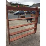 A pine hanging wallrack with five open shelves. (59.25in x 61in)